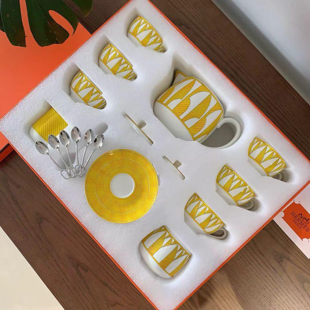 Herms Soleil dHerms porcelain tea set in a bright yellow and white pattern