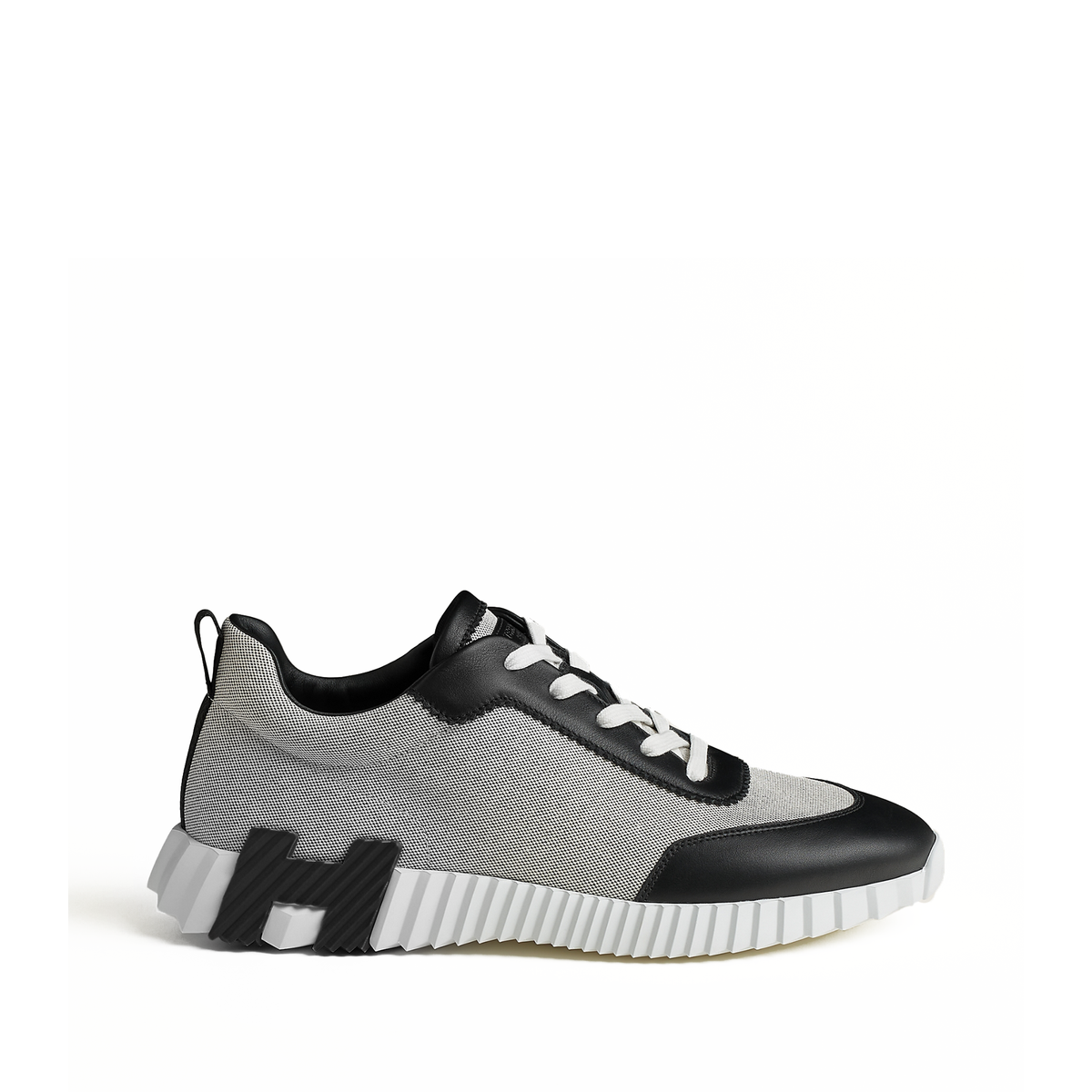 Hermes Bouncing sneakers featuring a light sole with a distinctive black H
