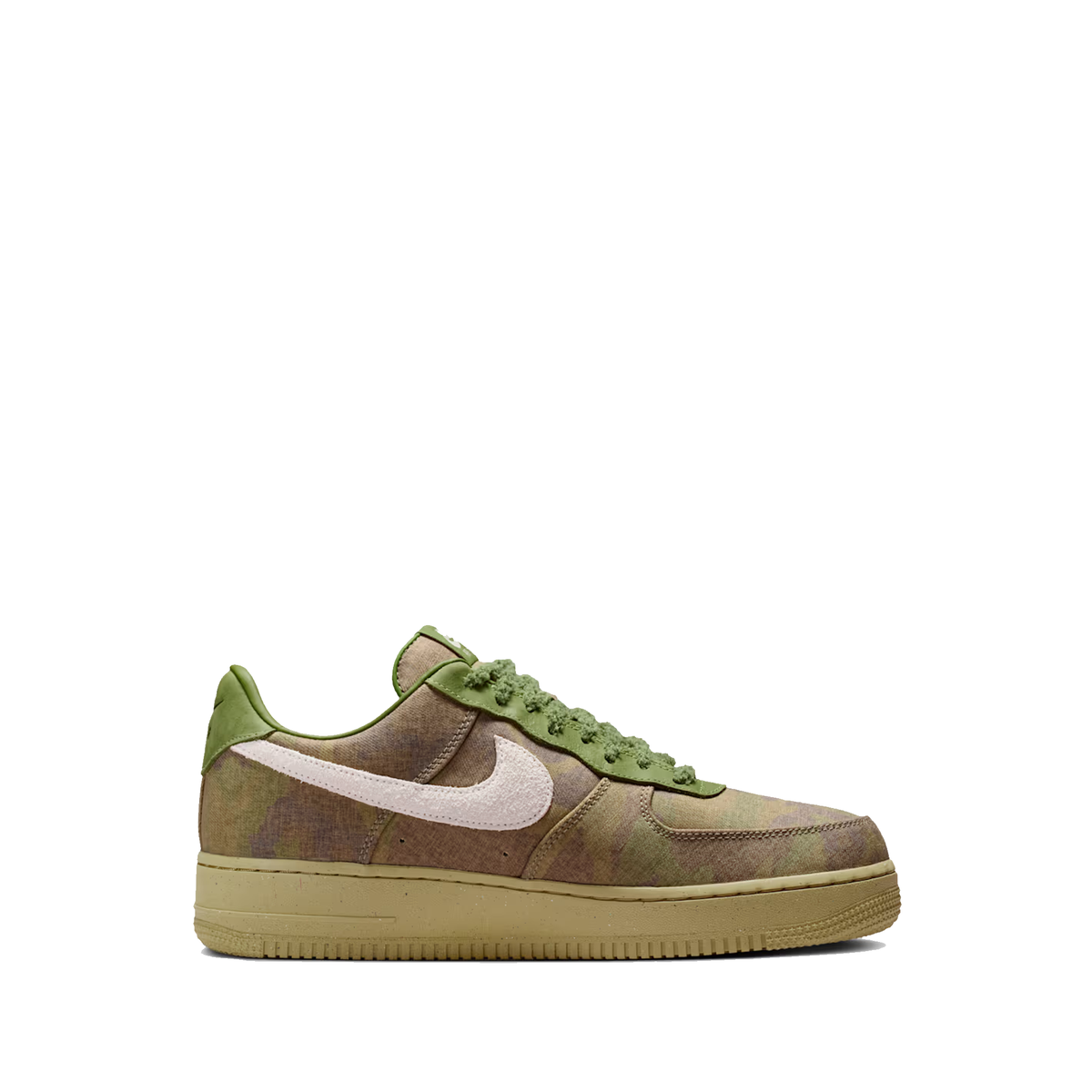 Nike Air Force 1 Low shoes feature a camouflage textile upper in asparagus and wheatgrass tones