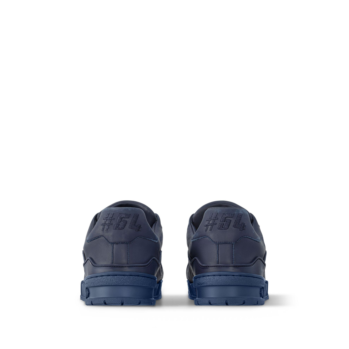 Louis Vuitton LV Trainer Distressed Sneaker in navy blue is crafted from vintage