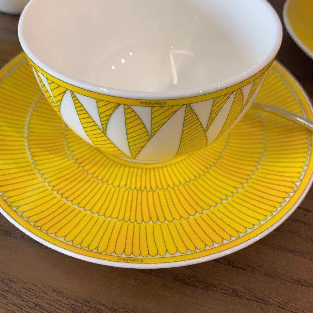 Herms Soleil dHerms porcelain tea set in a bright yellow and white pattern