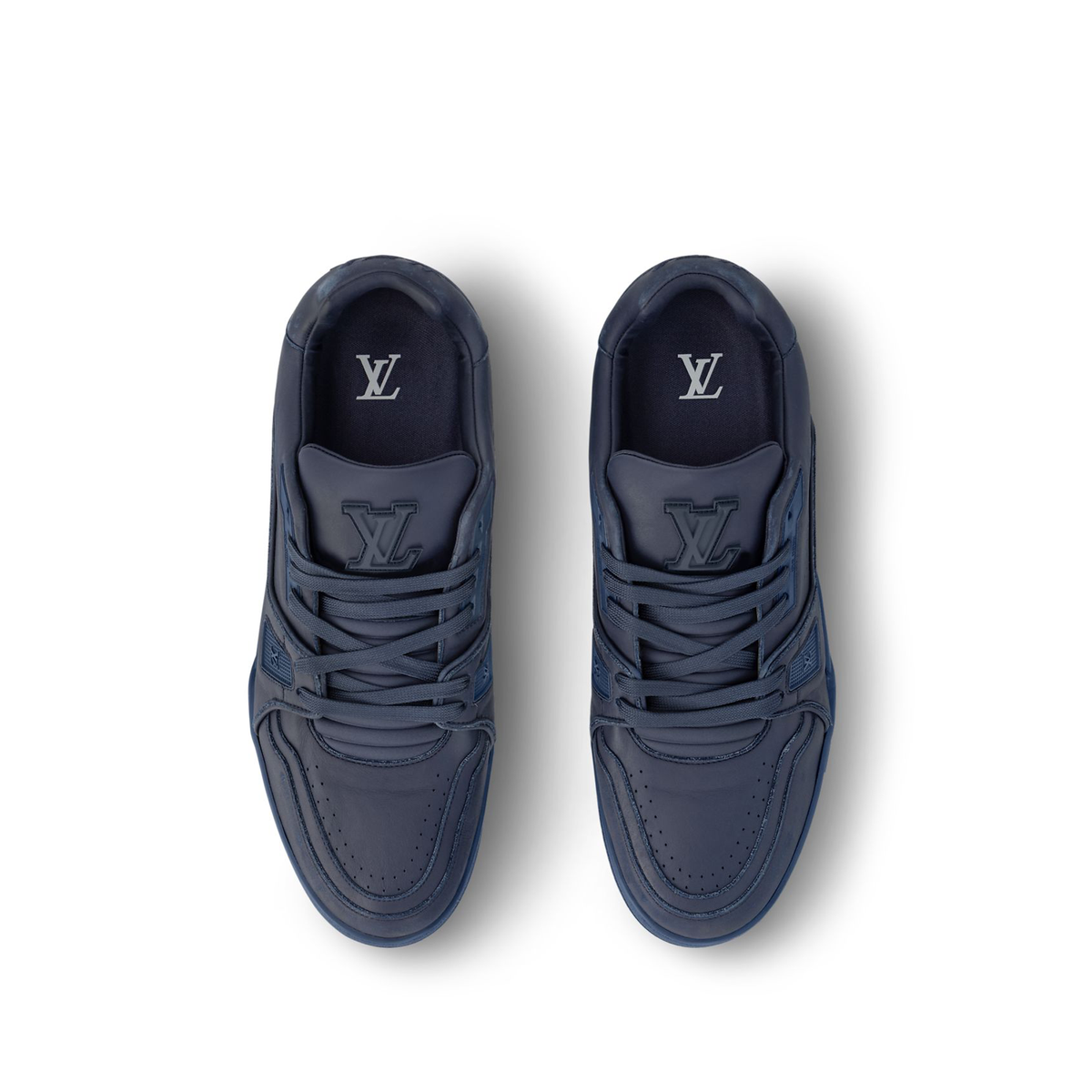Louis Vuitton LV Trainer Distressed Sneaker in navy blue is crafted from vintage