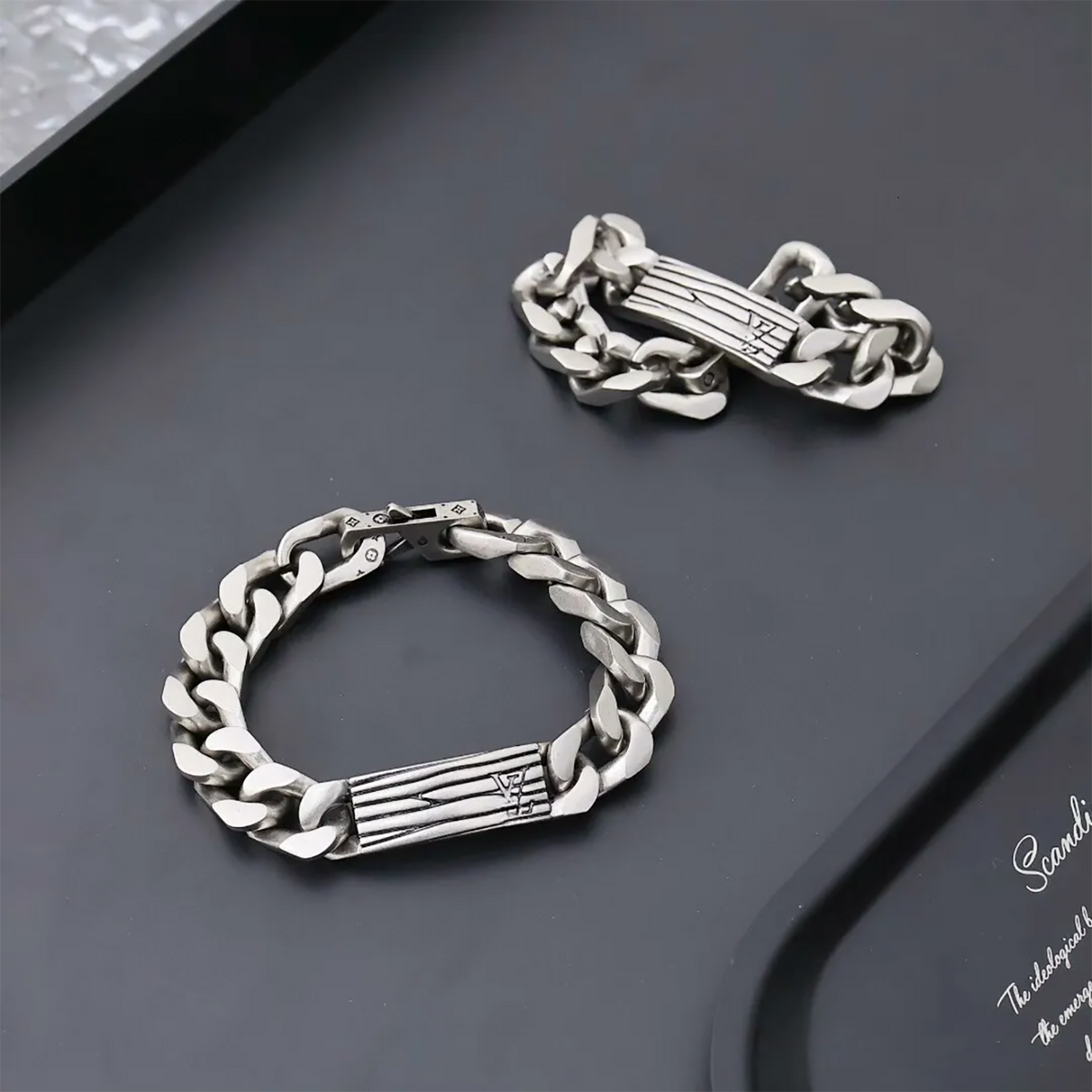Louis Vuitton silver color metal chain bracelet with an engraved Monogram pattern