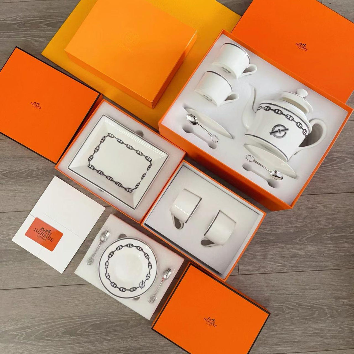 luxurious Herms Chaine dAncre porcelain tea set in platinum silver featuring iconic anchor chain motifs