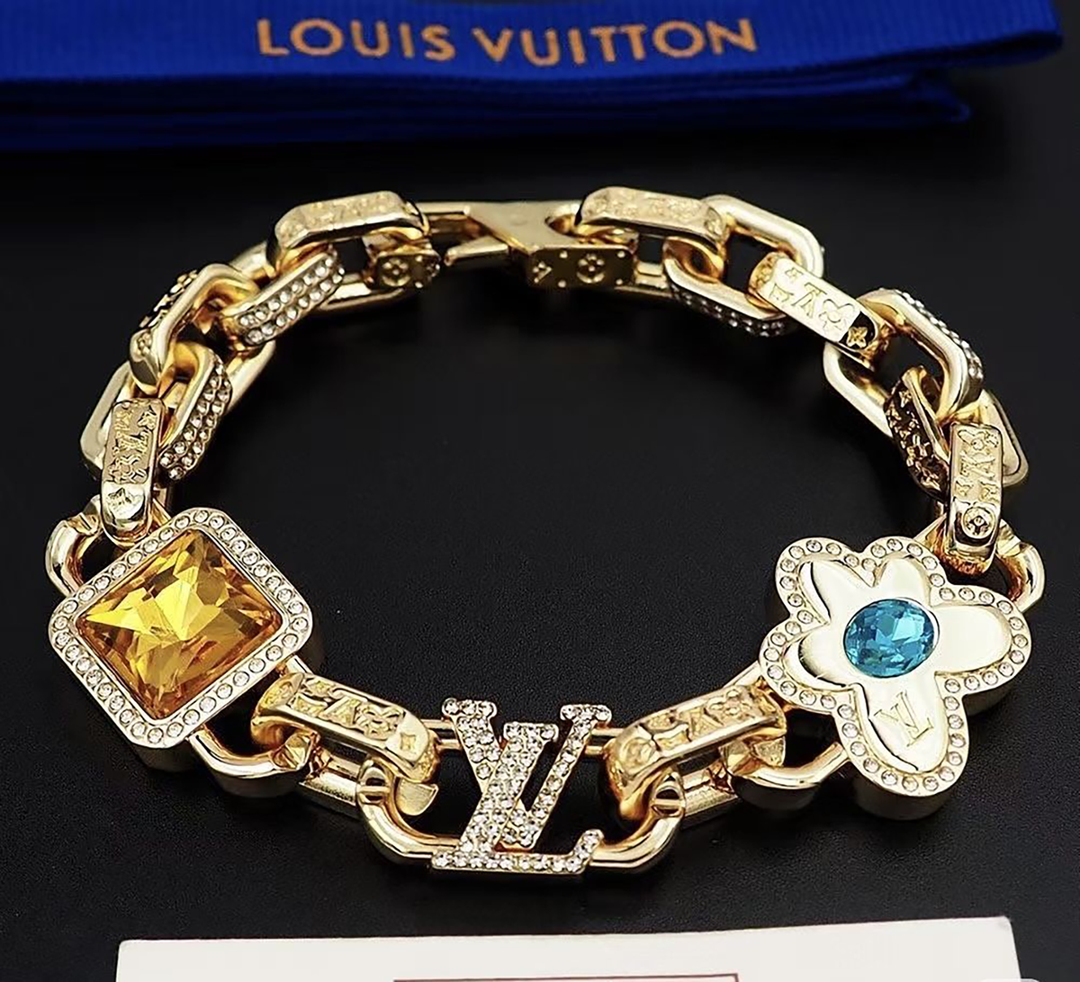 Louis Vuitton Monogram Gold bracelet featuring black silver