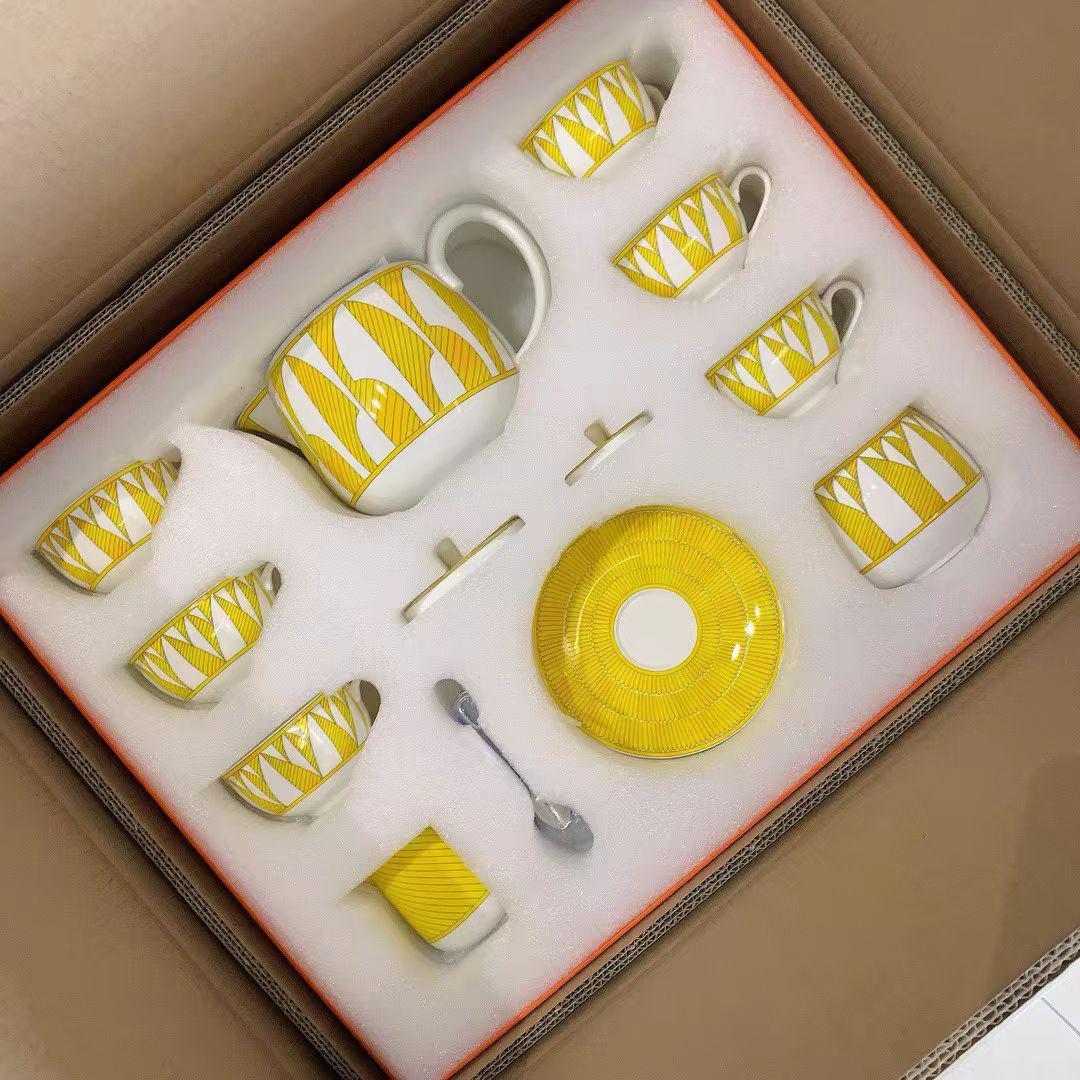 Herms Soleil dHerms porcelain tea set in a bright yellow and white pattern