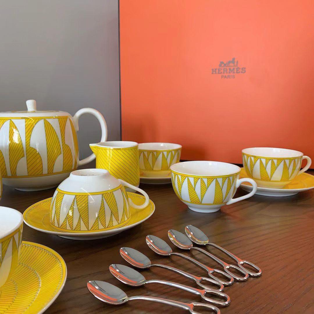 Herms Soleil dHerms porcelain tea set in a bright yellow and white pattern