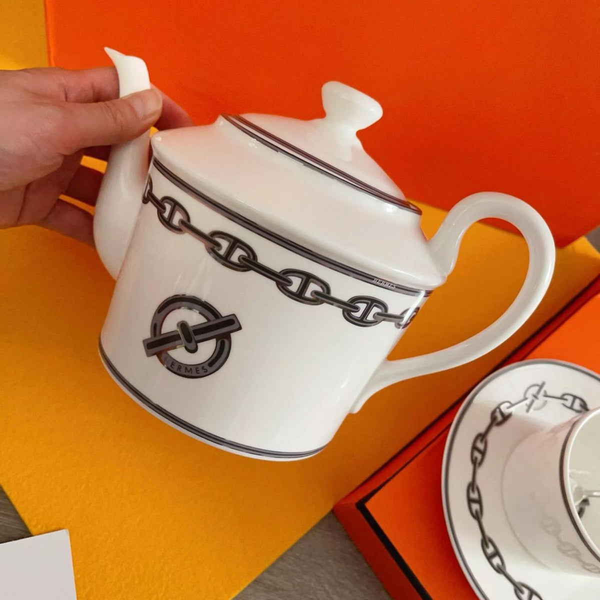 luxurious Herms Chaine dAncre porcelain tea set in platinum silver featuring iconic anchor chain motifs