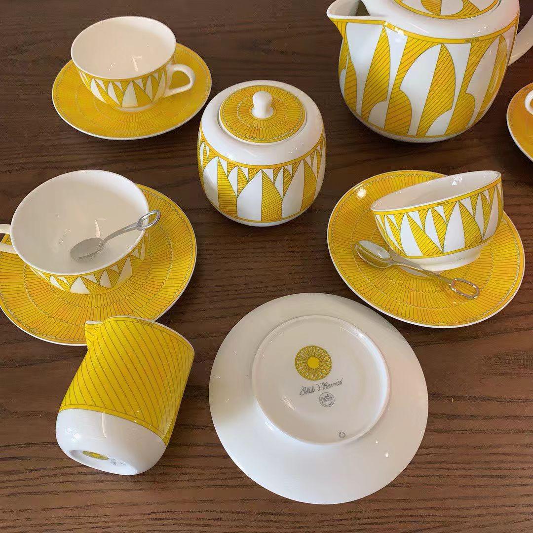 Herms Soleil dHerms porcelain tea set in a bright yellow and white pattern