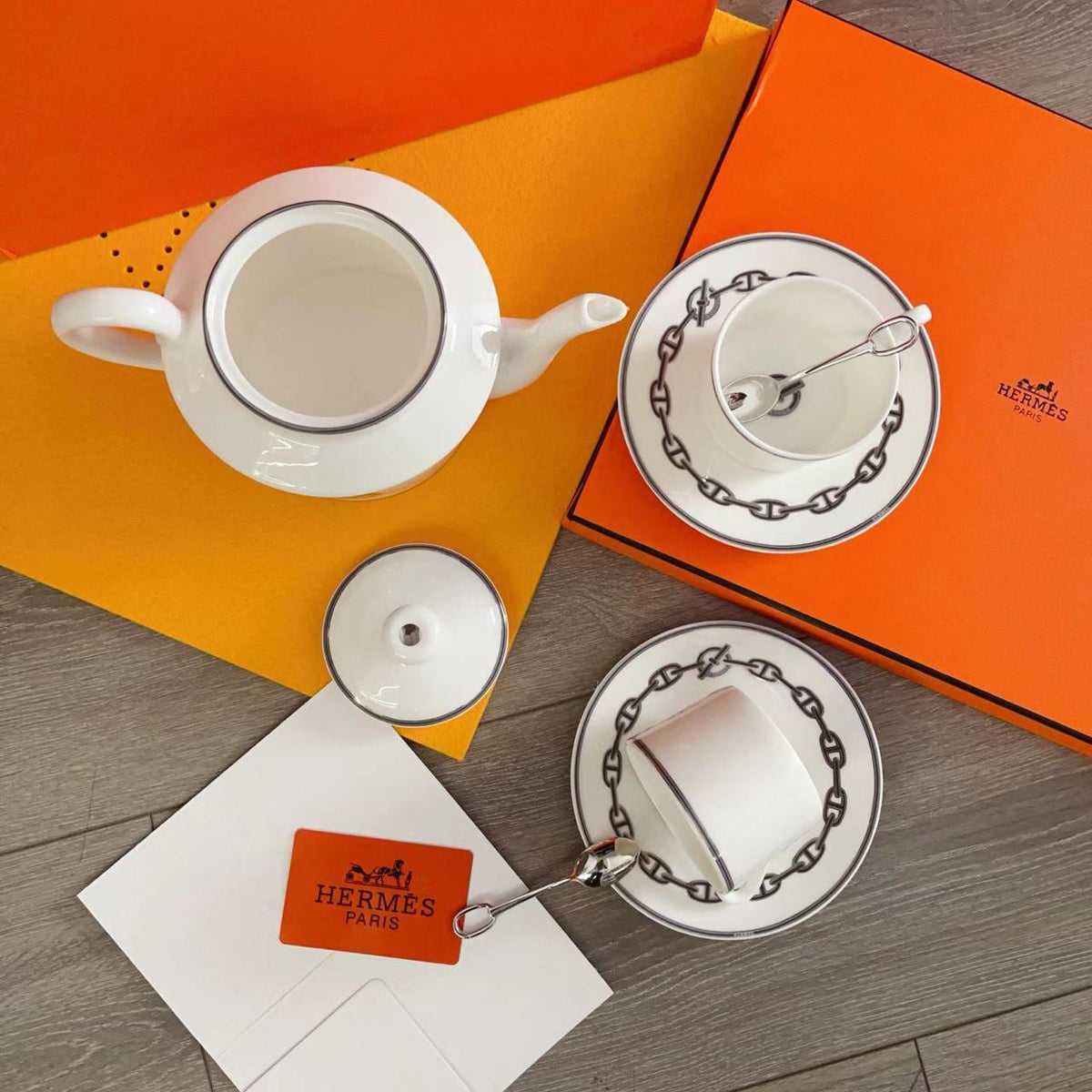 luxurious Herms Chaine dAncre porcelain tea set in platinum silver featuring iconic anchor chain motifs