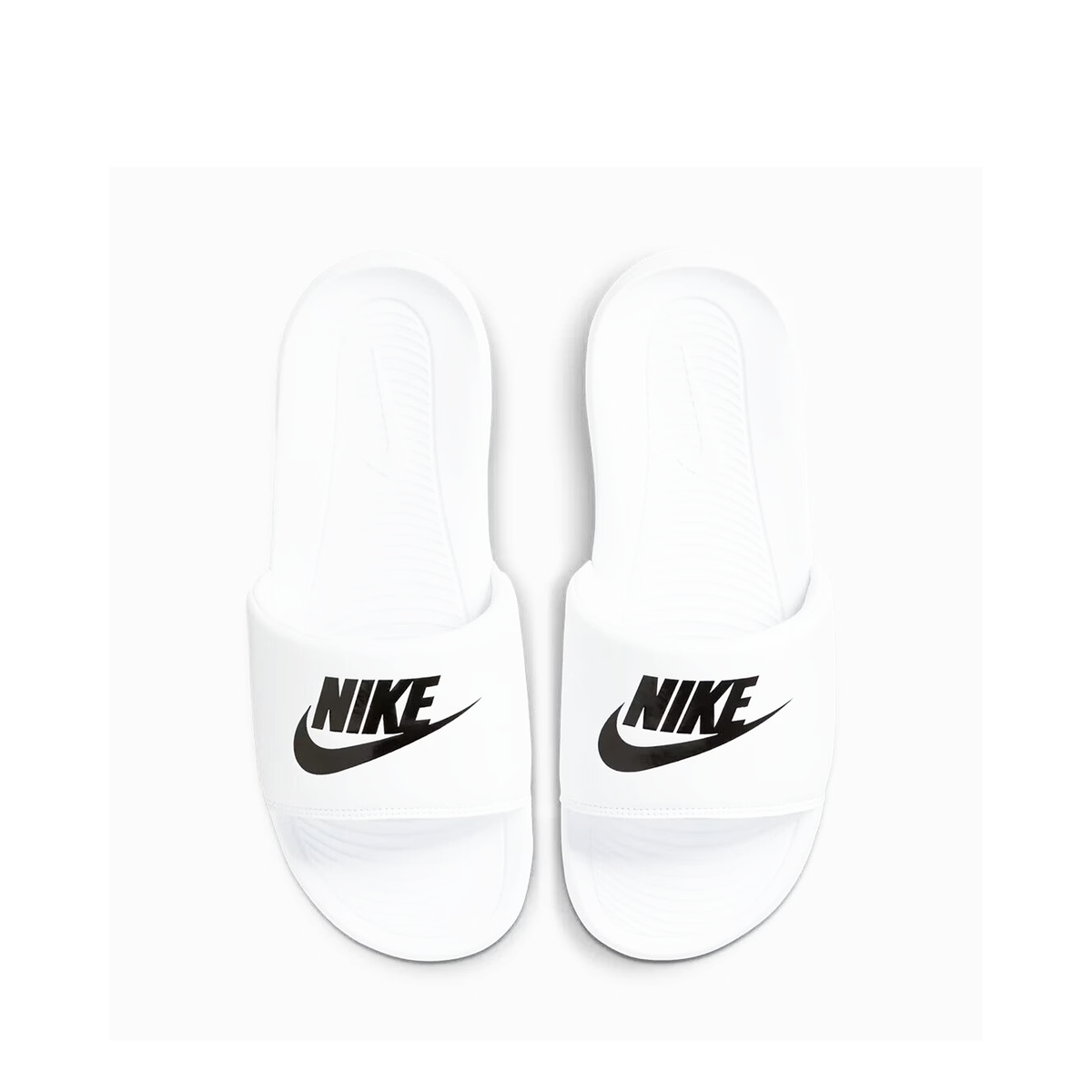 Nike Victori One slide in white with a black logo